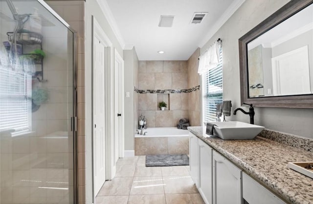 6319 Founding Dr, Katy, TX 77449 - full bath featuring double vanity, a garden tub, a stall shower, tile patterned floors, and ornamental molding