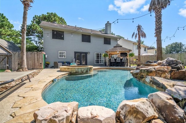 6319 Founding Dr, Katy, TX 77449 - view of pool with a gazebo, a fenced backyard, a patio area, and a pool with connected hot tub