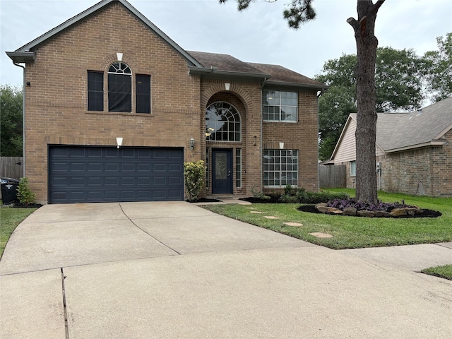 6319 Founding Dr, Katy, TX 77449 - traditional-style home featuring brick siding, a garage, a front yard, and concrete driveway