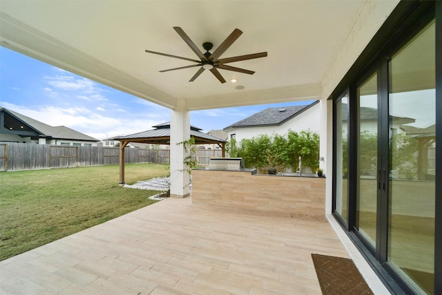 29602 Beech Tree Bnd, Fulshear, TX 77494 - fenced backyard featuring a gazebo, a patio area, and a ceiling fan