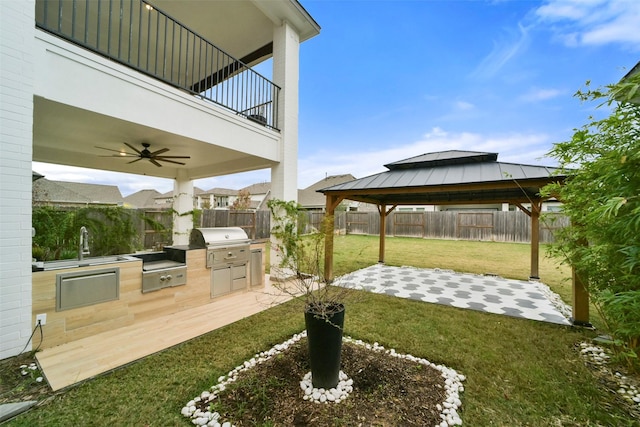 29602 Beech Tree Bnd, Fulshear, TX 77494 - fenced backyard featuring area for grilling, a gazebo, a ceiling fan, a patio, and a balcony