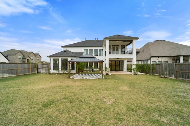 29602 Beech Tree Bnd, Fulshear, TX 77494 - rear view of house with a gazebo, a patio, a fenced backyard, ceiling fan, and a balcony