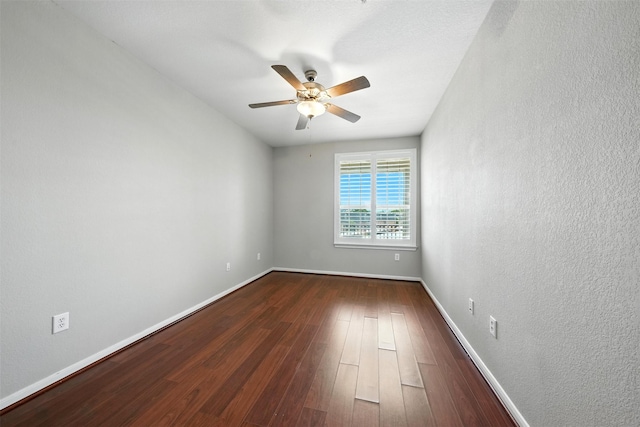 7575 Kirby Dr Unit 2204, Houston, TX 77030 - spare room featuring a ceiling fan, dark wood finished floors, and a textured wall