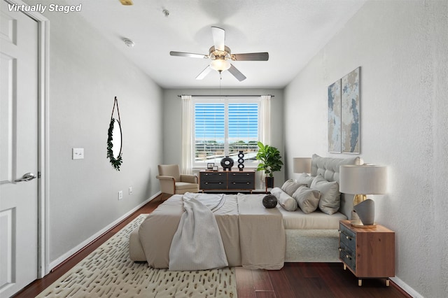 7575 Kirby Dr Unit 2204, Houston, TX 77030 - bedroom featuring dark wood-type flooring and a ceiling fan