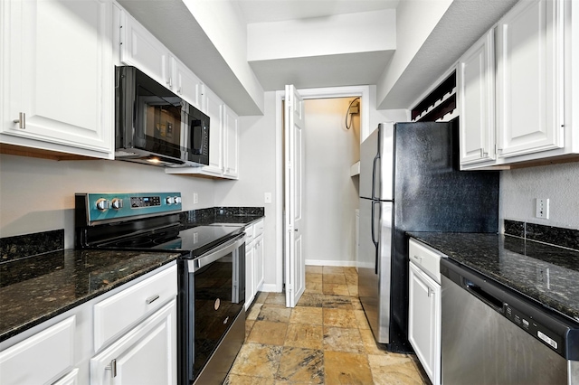 7575 Kirby Dr Unit 2204, Houston, TX 77030 - kitchen with appliances with stainless steel finishes, stone tile flooring, white cabinets, and dark stone counters
