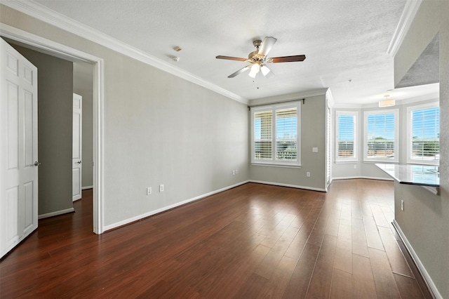7575 Kirby Dr Unit 2204, Houston, TX 77030 - spare room with a ceiling fan, ornamental molding, dark wood-style floors, a textured ceiling, and a smoke detector
