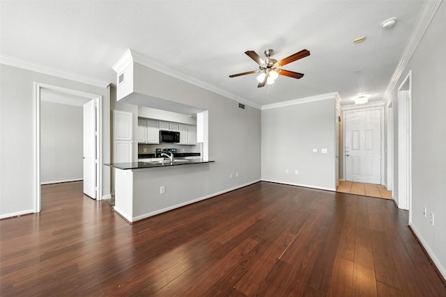 7575 Kirby Dr Unit 2204, Houston, TX 77030 - unfurnished living room with ceiling fan, dark wood-type flooring, and crown molding