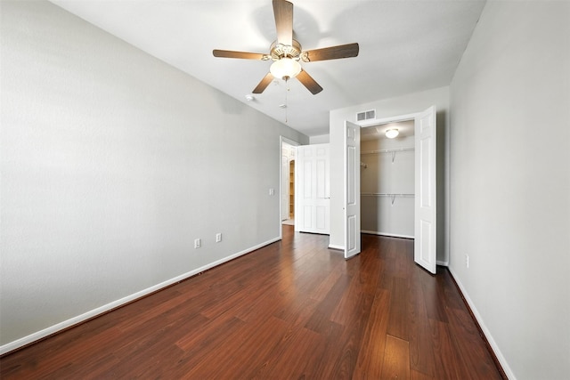 7575 Kirby Dr Unit 2204, Houston, TX 77030 - unfurnished bedroom with wood finished floors, a closet, a walk in closet, and a ceiling fan
