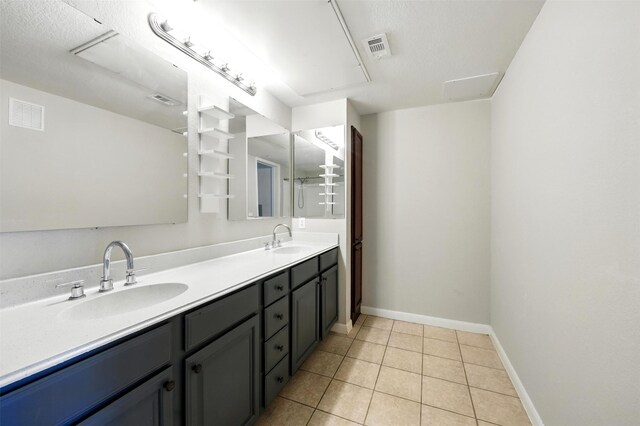 7575 Kirby Dr Unit 2204, Houston, TX 77030 - bathroom with double vanity and tile patterned flooring