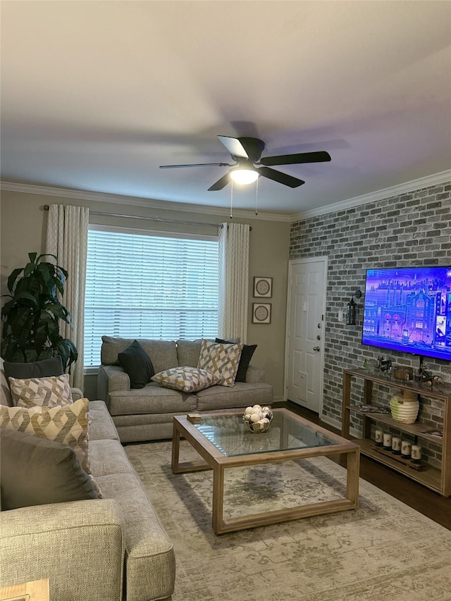 2255 Braeswood Park Dr Unit 145, Houston, TX 77030 - living area featuring ornamental molding, ceiling fan, wood finished floors, and brick wall