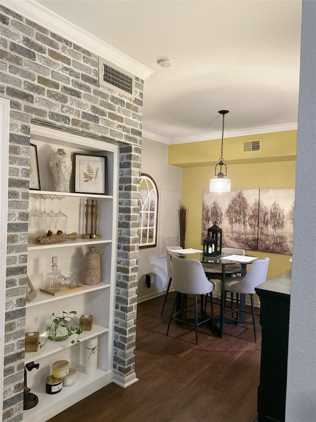 2255 Braeswood Park Dr Unit 145, Houston, TX 77030 - dining space with dark wood-type flooring and crown molding