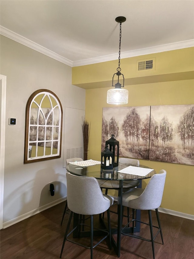 2255 Braeswood Park Dr Unit 145, Houston, TX 77030 - dining space featuring crown molding and wood finished floors