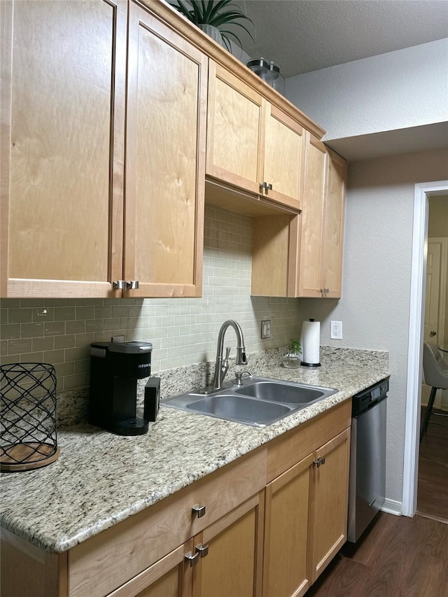 2255 Braeswood Park Dr Unit 145, Houston, TX 77030 - kitchen with dishwasher, dark wood-style flooring, backsplash, light brown cabinetry, and light stone countertops