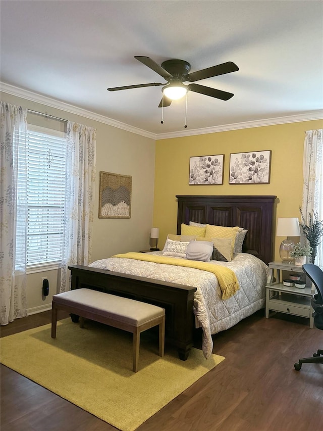 2255 Braeswood Park Dr Unit 145, Houston, TX 77030 - bedroom featuring dark wood-type flooring, ornamental molding, and a ceiling fan