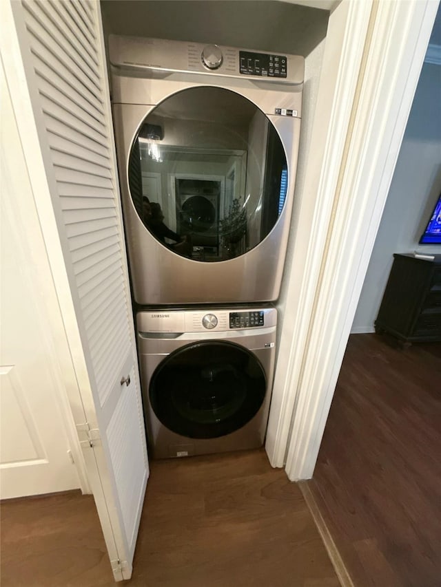 2255 Braeswood Park Dr Unit 145, Houston, TX 77030 - laundry room with estacked washer and dryer and wood finished floors