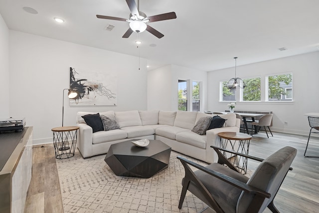 18615 Parkland Xing, Cypress, TX 77433 - living area with light wood-style floors, healthy amount of natural light, recessed lighting, and a ceiling fan