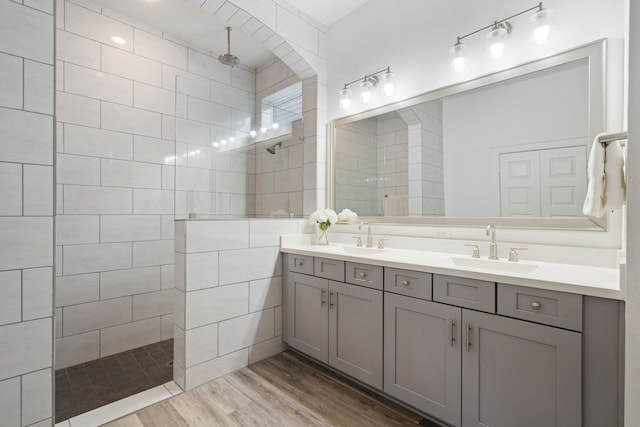 18615 Parkland Xing, Cypress, TX 77433 - bathroom with double vanity, walk in shower, and wood finished floors