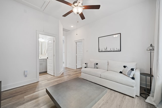 18615 Parkland Xing, Cypress, TX 77433 - living room featuring a ceiling fan, light wood-style floors, attic access, and recessed lighting