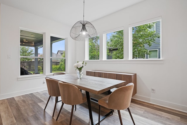 18615 Parkland Xing, Cypress, TX 77433 - dining space featuring plenty of natural light and wood finished floors