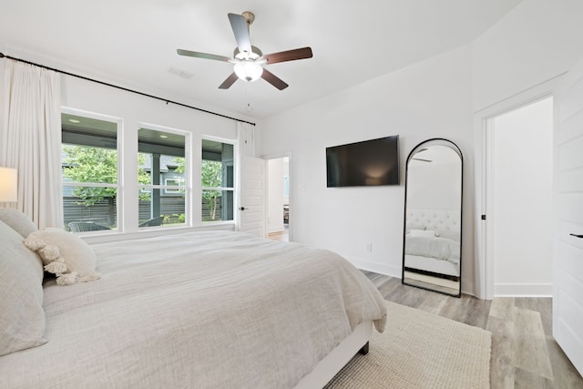 18615 Parkland Xing, Cypress, TX 77433 - bedroom featuring light wood-style flooring and a ceiling fan