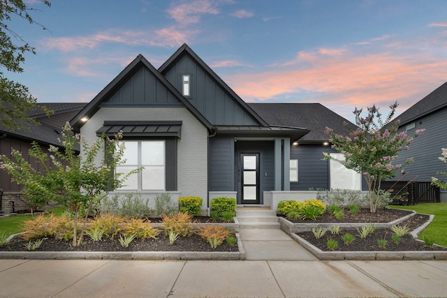 18615 Parkland Xing, Cypress, TX 77433 - view of front of property featuring board and batten siding and brick siding