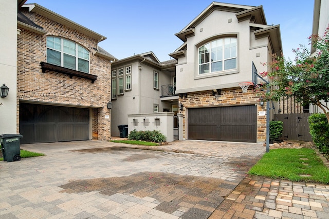 1302 Westview Garden Ct, Houston, TX 77055 - view of front of home featuring a garage, decorative driveway, and stucco siding