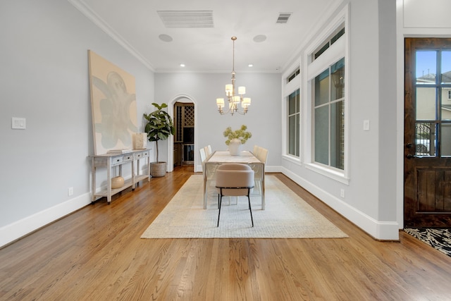 1302 Westview Garden Ct, Houston, TX 77055 - dining area with a chandelier, wood finished floors, ornamental molding, and recessed lighting