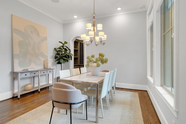 1302 Westview Garden Ct, Houston, TX 77055 - dining area with a chandelier, wood finished floors, crown molding, and recessed lighting