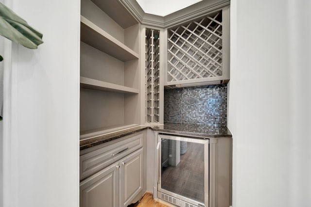 1302 Westview Garden Ct, Houston, TX 77055 - wine room featuring beverage cooler and a bar