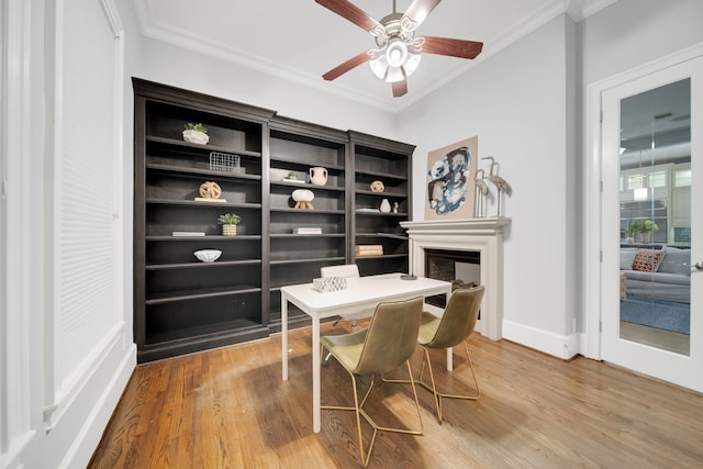 1302 Westview Garden Ct, Houston, TX 77055 - office with ornamental molding, wood finished floors, a ceiling fan, and a fireplace