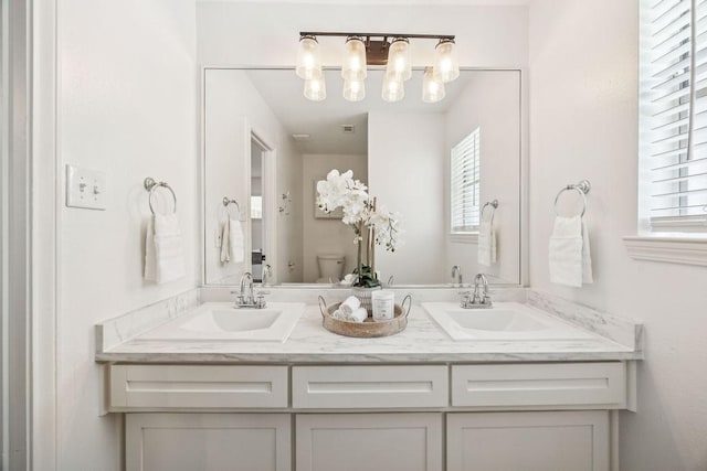 5515 Dumfries Dr, Houston, TX 77096 - bathroom featuring double vanity and toilet