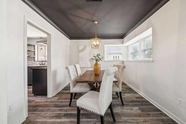 5515 Dumfries Dr, Houston, TX 77096 - dining space featuring a chandelier, dark wood-style flooring, and ornamental molding