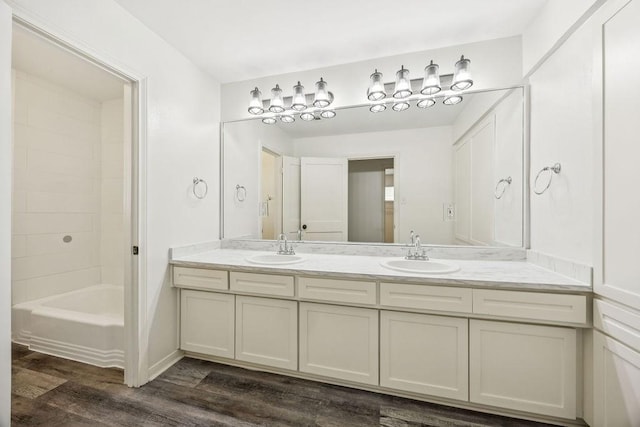 5515 Dumfries Dr, Houston, TX 77096 - bathroom with double vanity, wood finished floors, and  shower combination