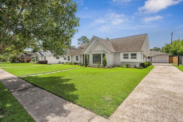 5515 Dumfries Dr, Houston, TX 77096 - view of front of house with a gate, brick siding, and roof with shingles