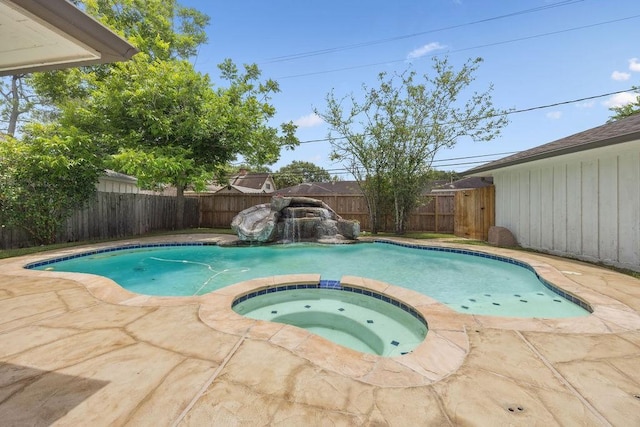 5515 Dumfries Dr, Houston, TX 77096 - view of swimming pool featuring a fenced backyard, a pool with connected hot tub, and a patio area