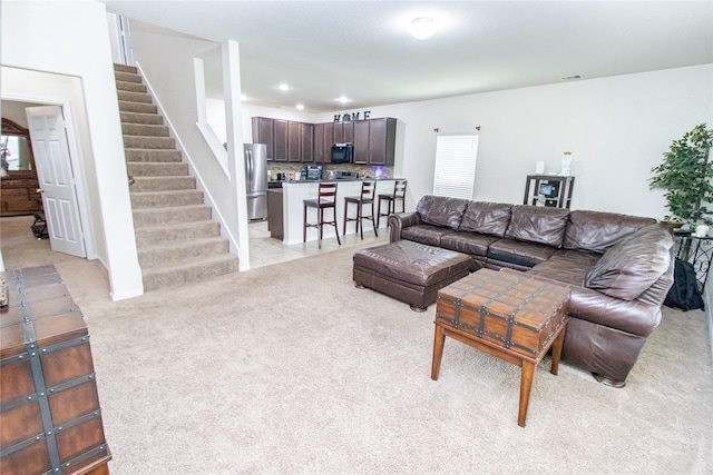 8222 Pastel Dawn Trce, Houston, TX 77049 - living area with light colored carpet, stairs, and recessed lighting