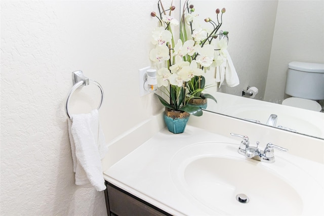 8222 Pastel Dawn Trce, Houston, TX 77049 - half bathroom featuring vanity and a textured wall