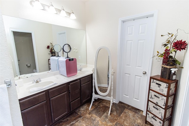 8222 Pastel Dawn Trce, Houston, TX 77049 - bathroom featuring double vanity and stone finish floors
