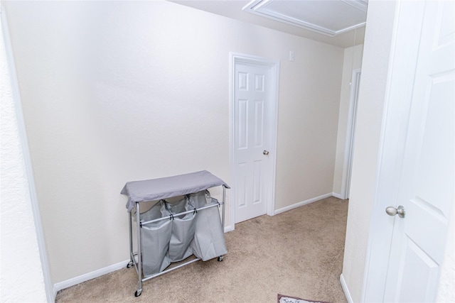 8222 Pastel Dawn Trce, Houston, TX 77049 - miscellaneous room with light carpet and attic access