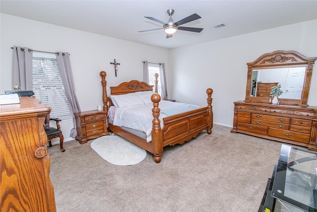 8222 Pastel Dawn Trce, Houston, TX 77049 - bedroom featuring light colored carpet, multiple windows, and a ceiling fan