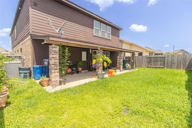 8222 Pastel Dawn Trce, Houston, TX 77049 - rear view of house featuring a patio area, a fenced backyard, and brick siding