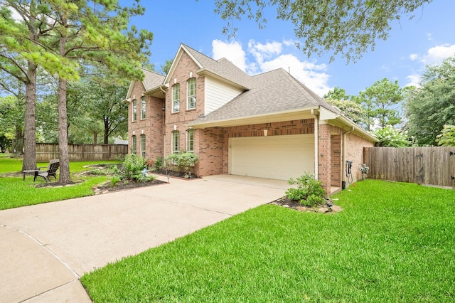 16018 Lower Lake Dr, Cypress, TX 77433 - traditional home with a garage, roof with shingles, brick siding, and concrete driveway