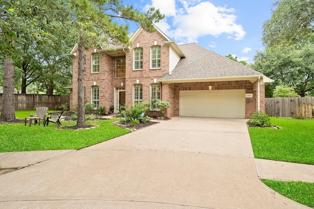 16018 Lower Lake Dr, Cypress, TX 77433 - view of front of house featuring brick siding, an attached garage, concrete driveway, and roof with shingles