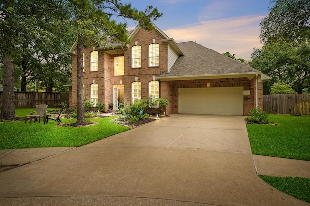 16018 Lower Lake Dr, Cypress, TX 77433 - view of front facade with an attached garage, brick siding, concrete driveway, and roof with shingles