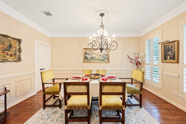16018 Lower Lake Dr, Cypress, TX 77433 - dining space with a chandelier, plenty of natural light, ornamental molding, wood finished floors, and wainscoting