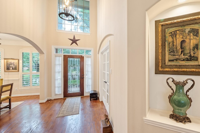 16018 Lower Lake Dr, Cypress, TX 77433 - entryway with wood finished floors, arched walkways, and a towering ceiling
