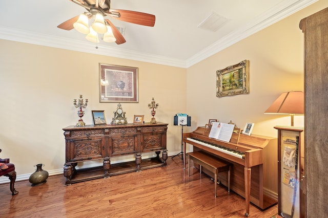 16018 Lower Lake Dr, Cypress, TX 77433 - sitting room with wood finished floors, crown molding, and a ceiling fan