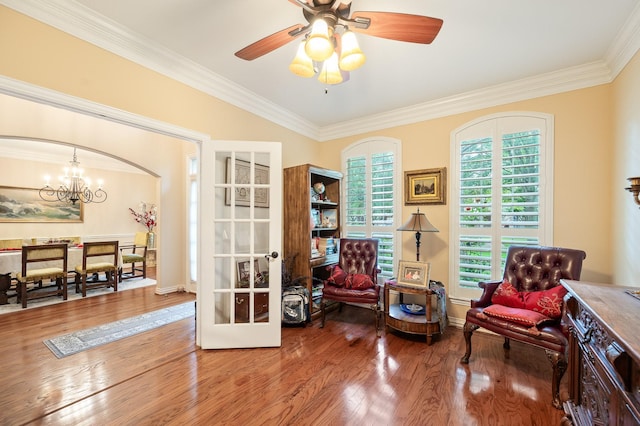 16018 Lower Lake Dr, Cypress, TX 77433 - living area with wood finished floors, ornamental molding, a chandelier, a ceiling fan, and french doors