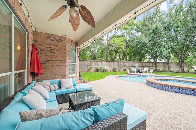 16018 Lower Lake Dr, Cypress, TX 77433 - fenced backyard featuring outdoor lounge area, a patio, a pool with connected hot tub, and a ceiling fan
