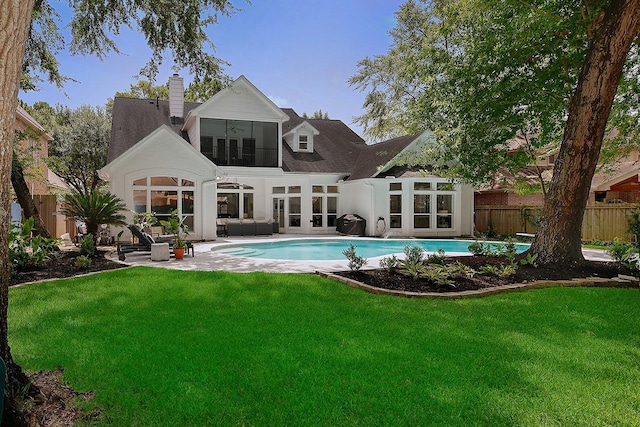 26 W Fairbranch Cir, The Woodlands, TX 77382 - back of house with french doors, a chimney, ceiling fan, an outdoor living space, and a patio